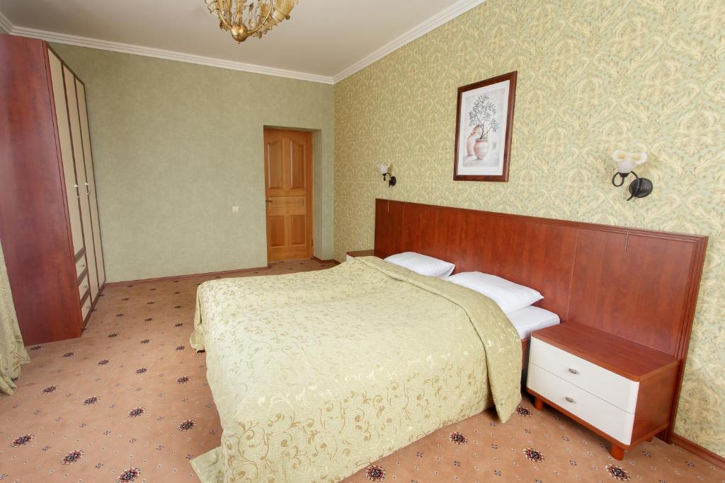 Postel nebo postele na pokoji v ubytování Pansionat Paradiz