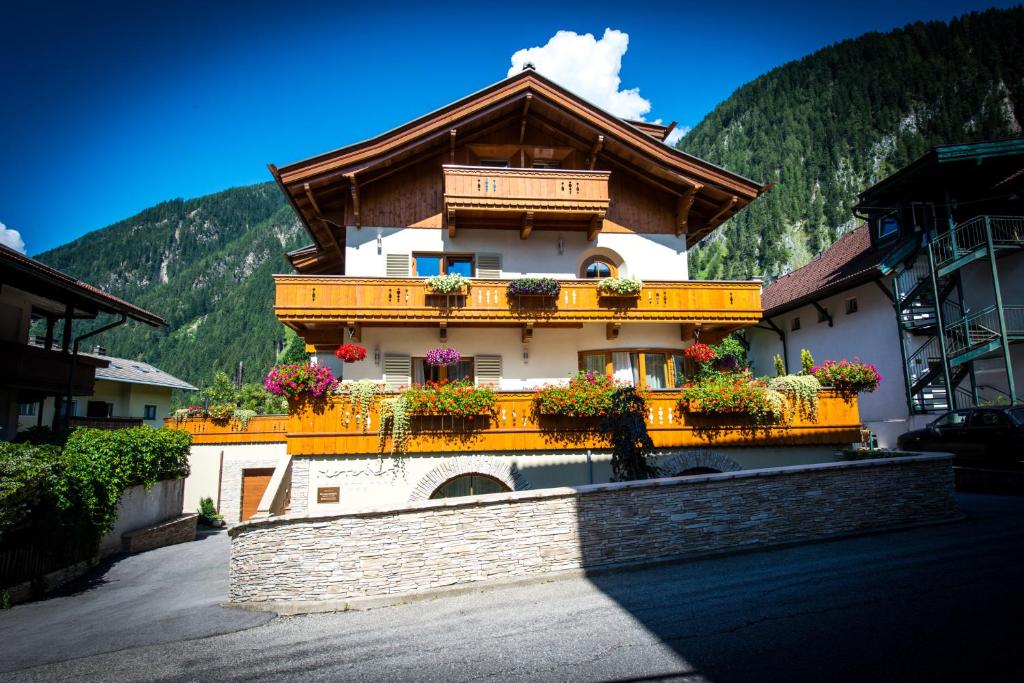 a building with flower boxes on the side of it at Moroder Haus in Mayrhofen