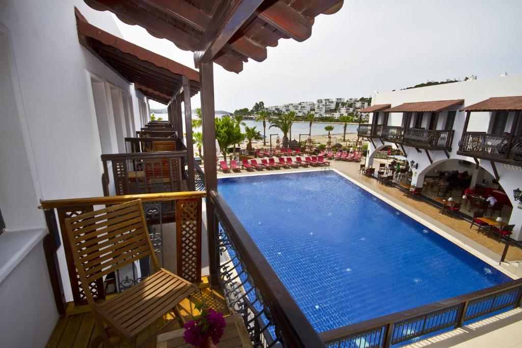 a view of a swimming pool from a balcony at Costa Bitezhan Hotel - All Inclusive in Bitez