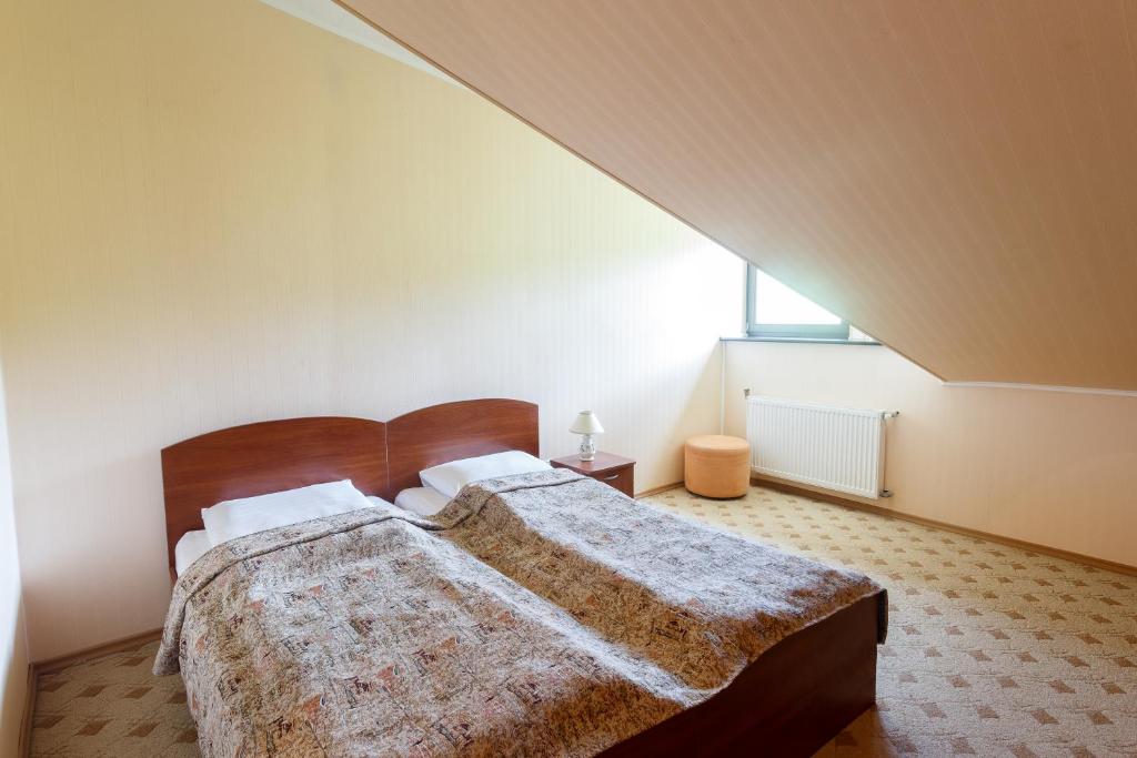 Postel nebo postele na pokoji v ubytování Pansionat Paradiz