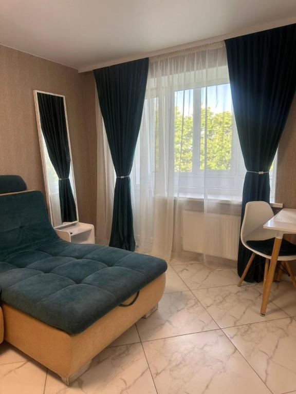 a bedroom with a large bed and a window at Одеська 129 in Golta