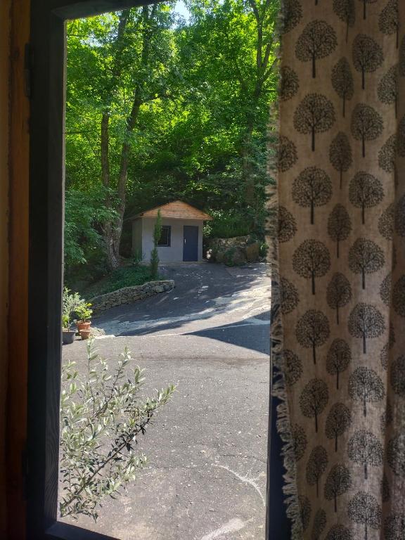 a view from a window of a driveway with trees at HUTS By Innwoods in Alaverdi