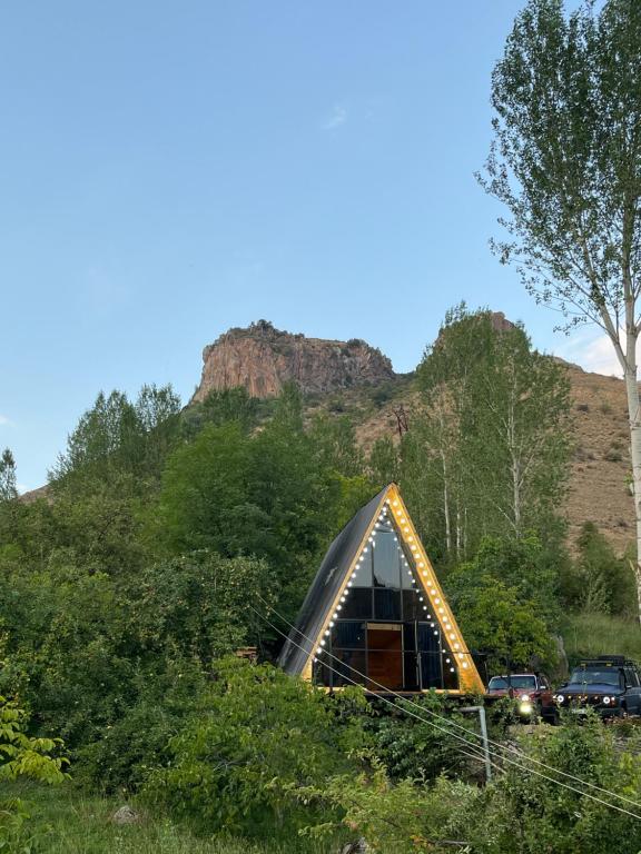 a dome house in the middle of a field at Green Garden 