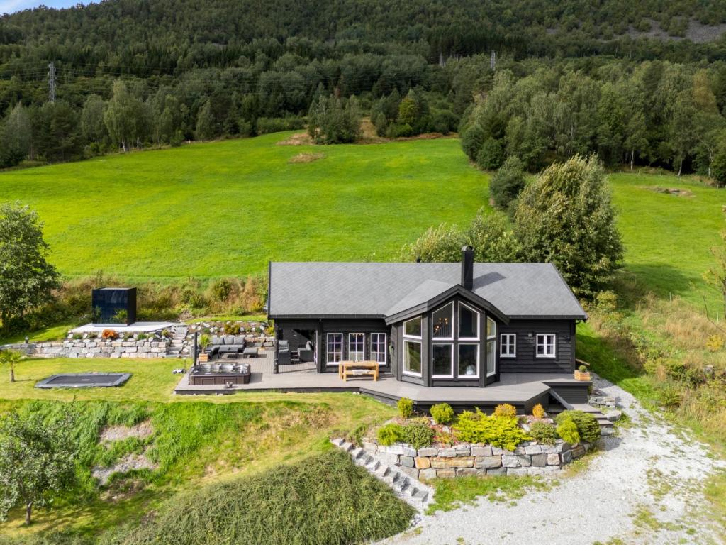 an aerial view of a black house on a hill at Lingåsen Panorama! in Valldal