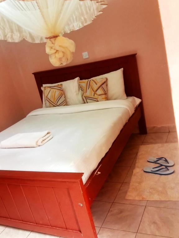 Ένα ή περισσότερα κρεβάτια σε δωμάτιο στο Villa serene hotel kitale