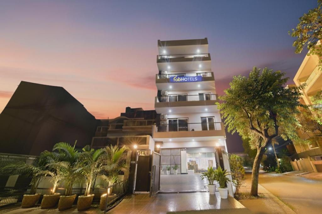 a building with a sign on the side of it at FabHotel Luxe 8 Stayz - Phase 1 Metro, Golf Course Road & Arjun Marg in Gurgaon