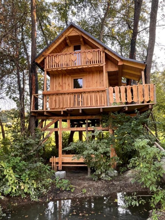 a tree house in the middle of a forest at Tree house - Ethno holistic village Apače in Apače