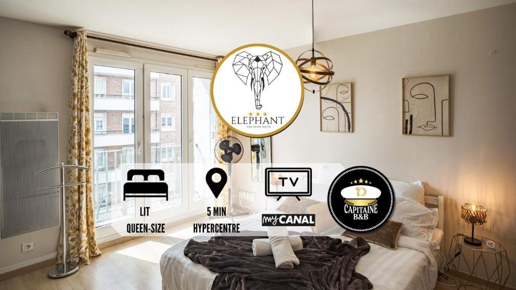 ein Schlafzimmer mit einem Bett mit Plakaten an der Wand in der Unterkunft Voltaire Elephant Suite - 5 min Hypercentre in Troyes