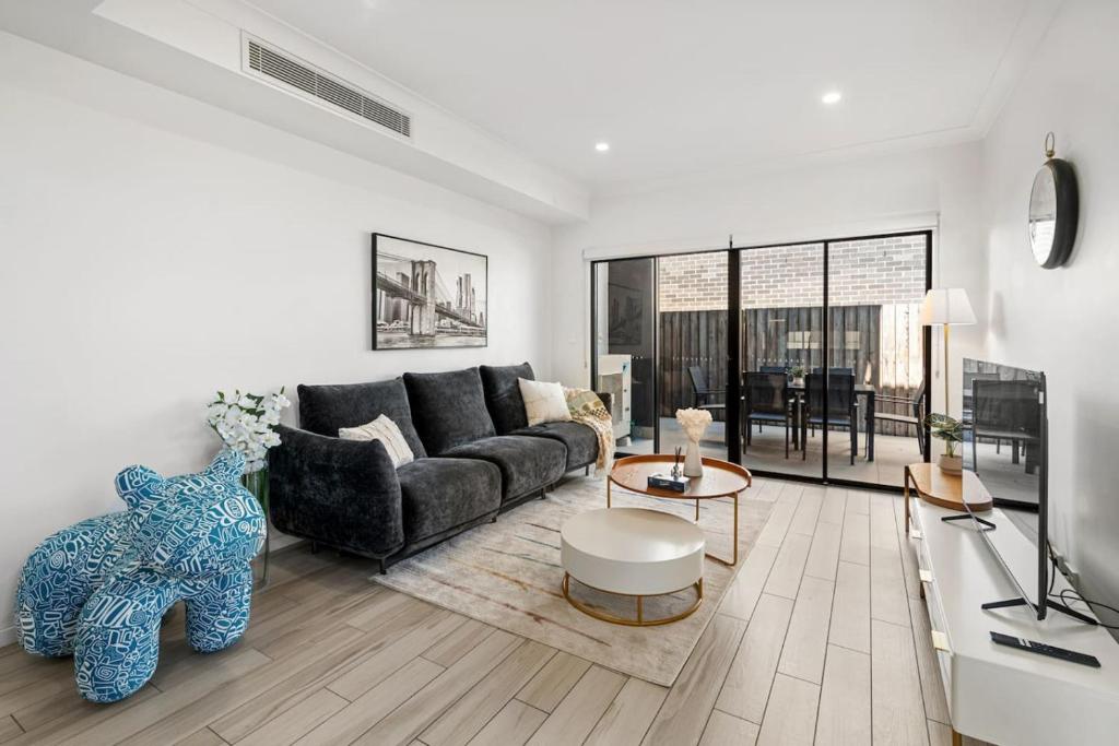 Posezení v ubytování Sunhaven Escape Three Storey Comfort for Families