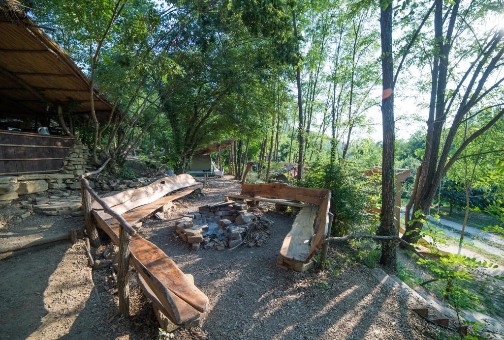 a group of wooden benches in a park at Adrenaline Check Kaki Event Place in Portorož