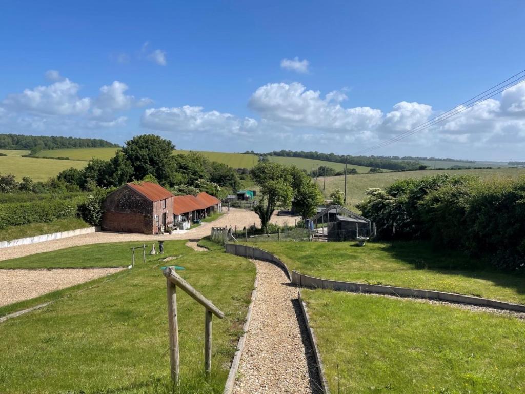 a view of a farm with a fence and buildings at 2 Bed in Thornicombe 90161 in Charlton Marshall