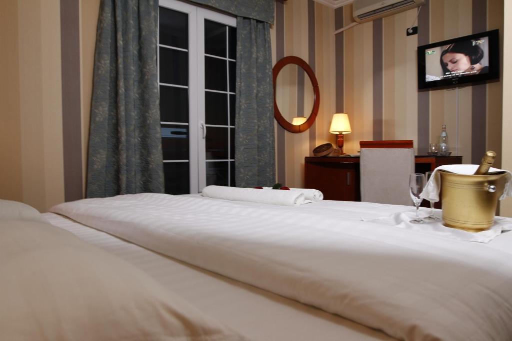 Postel nebo postele na pokoji v ubytování Bel Conti Hotel