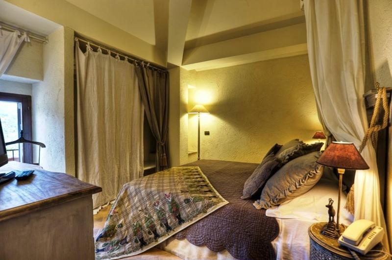 Postel nebo postele na pokoji v ubytování Il Poggio Country Resort