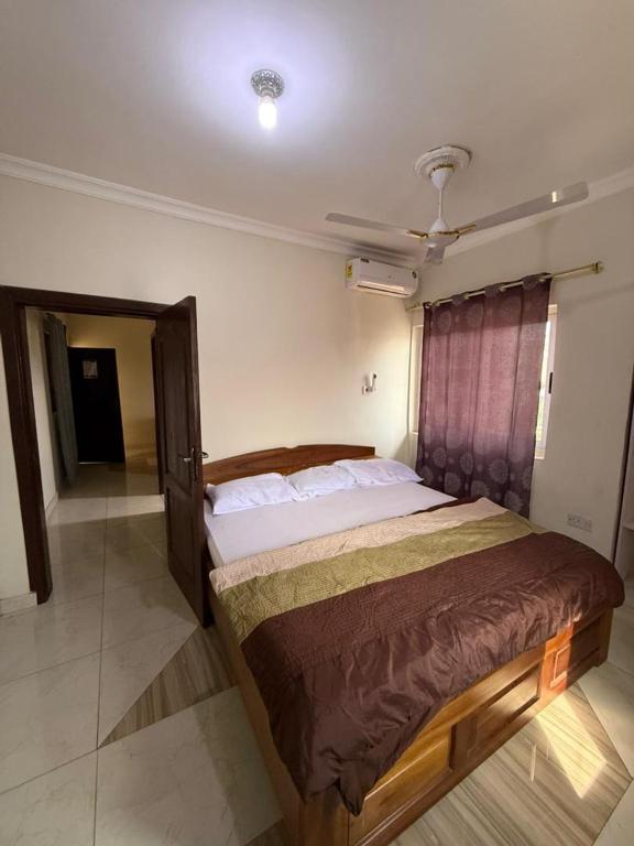 Giường trong phòng chung tại KAMF Lodge