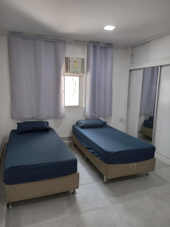 En eller flere senge i et værelse på Kitnet 203