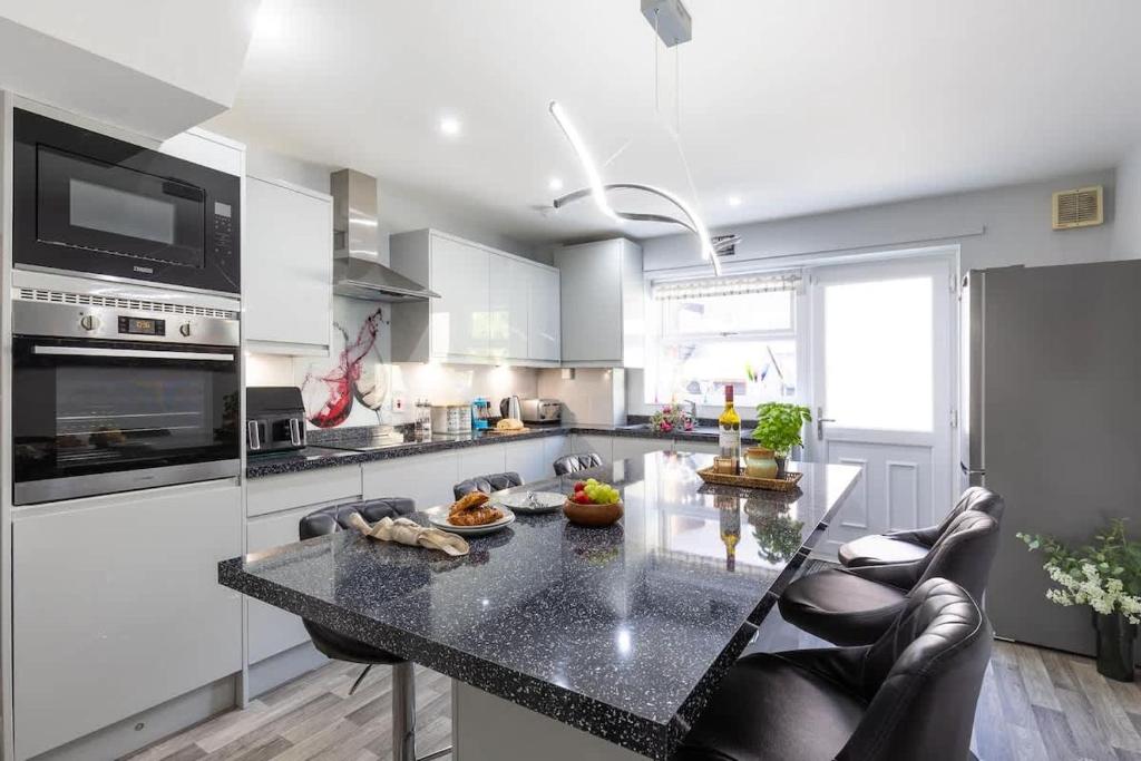 a kitchen with a large island with a counter top at Townhouse Harbour Retreat in Scarborough