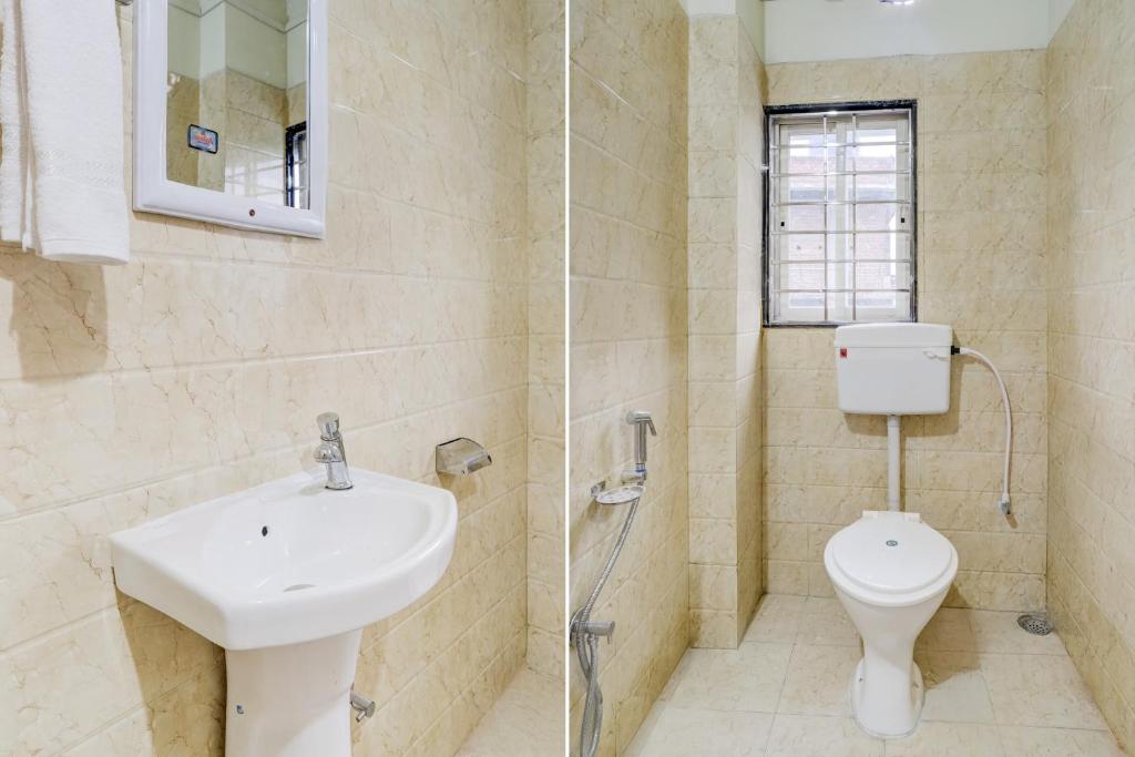 a bathroom with a sink and a toilet at Hotel O The Silver Stone in Guwahati