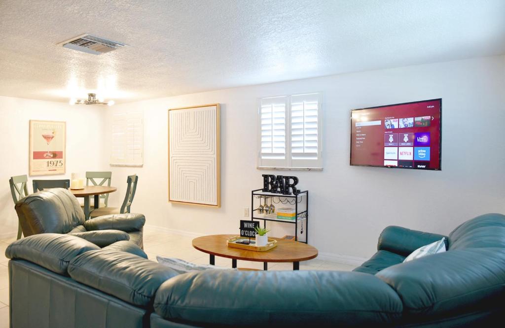 a living room with a blue couch and a table at Enjoy Sunset with Dolphin and Manatee in Hudson
