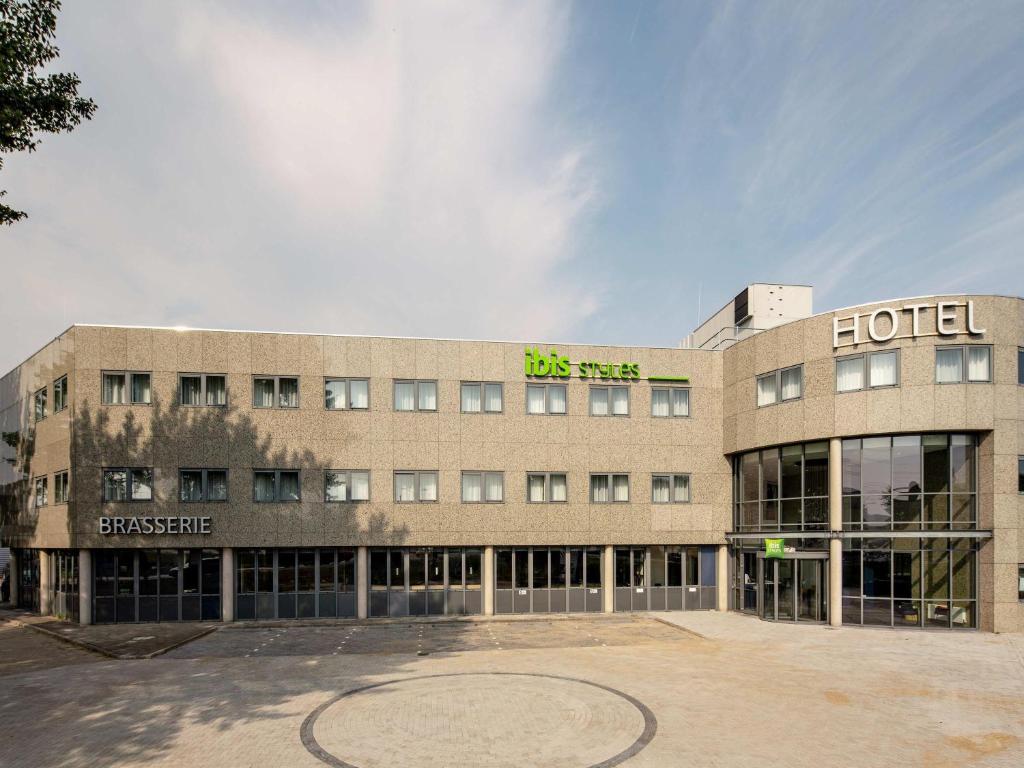a large building with a hotel sign on it at ibis Styles Almere in Almere