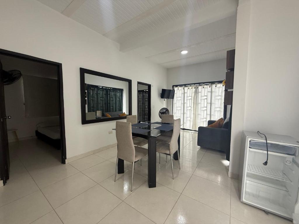 a living room with a dining room table and chairs at SANTYS HOUSE MELGAR apartamento amoblado para 6 personas in Melgar