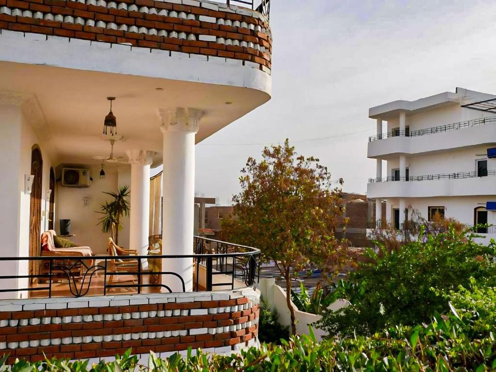 a view of a house with a balcony at Villa Quiet Place in Luxor