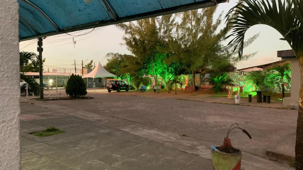 an empty street with green lights in the distance at Thomás more 1 Flat in Santa Rita
