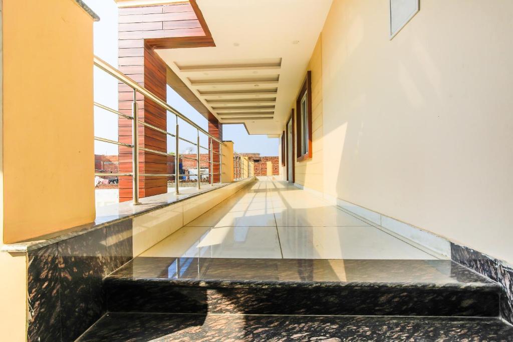 a corridor of a building with a glass floor at Super Hotel O Vaibhav laxmi Paradise in Lucknow