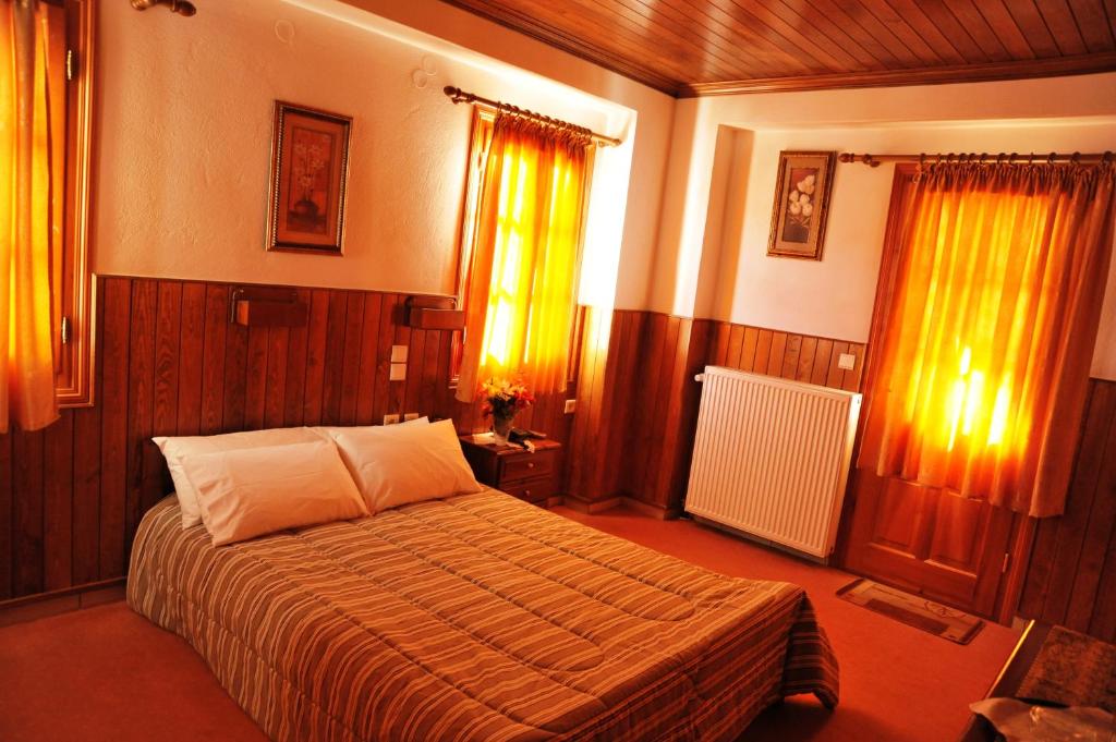 Postel nebo postele na pokoji v ubytování Hotel Anax
