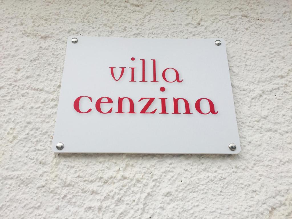 a white sign on a wall with the wordsilla centrina at Villa Cenzina in Marina di Pisticci