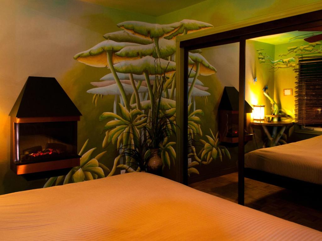 Katil atau katil-katil dalam bilik di Gîte Crystal Inn