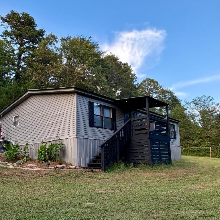 a small house with a gambrel roof at Black Bear Hideaway in Pickens