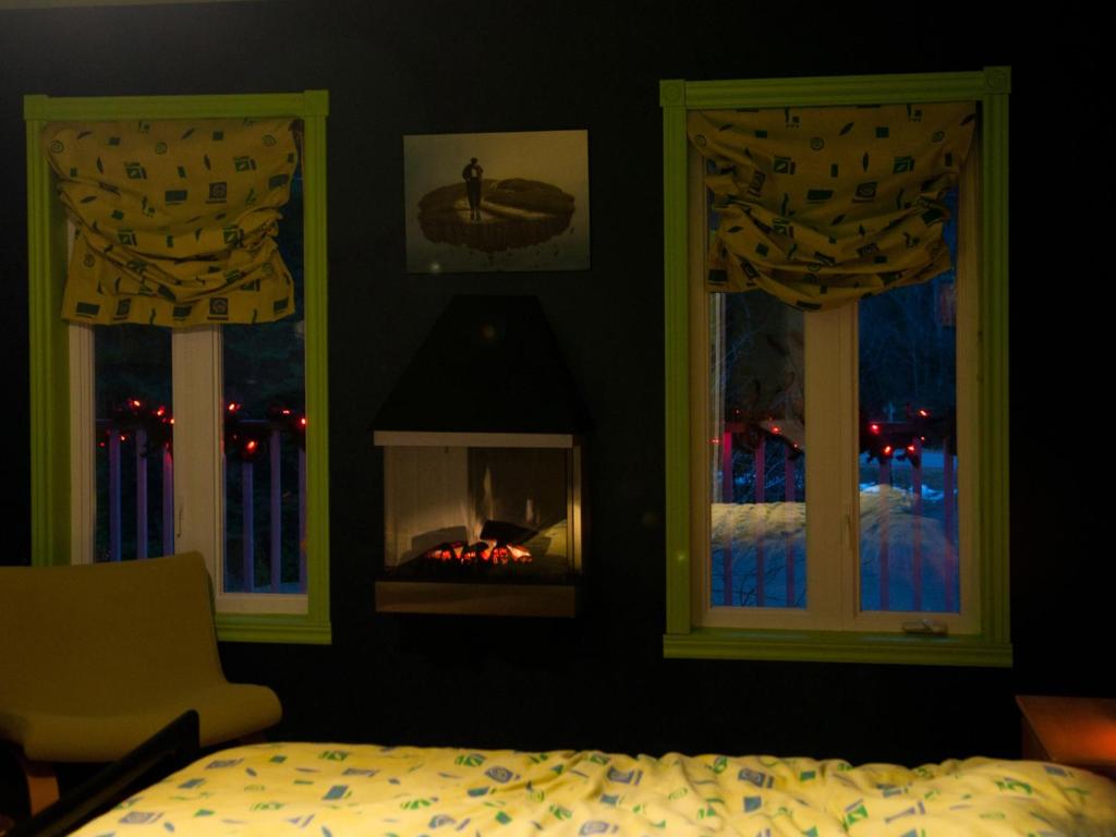Katil atau katil-katil dalam bilik di Gîte Crystal Inn