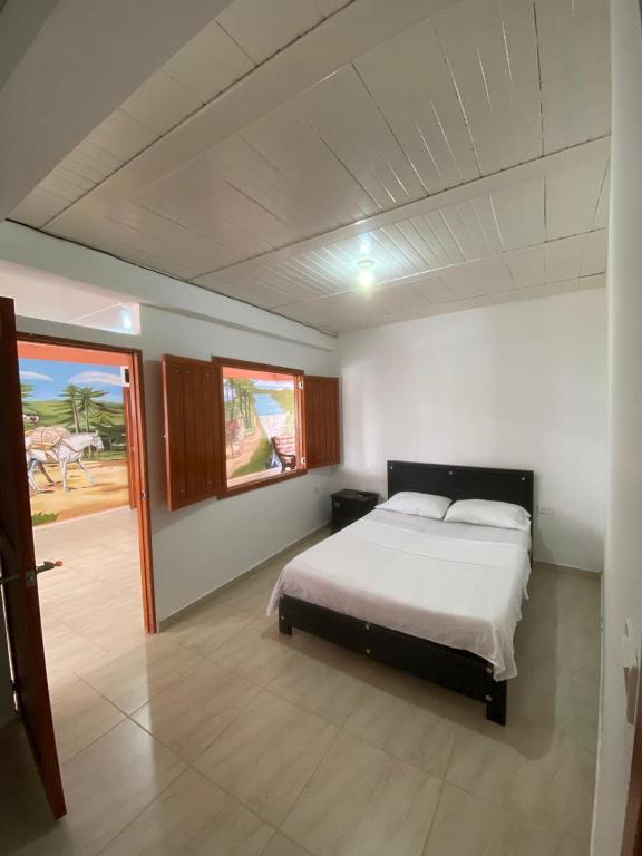 Postel nebo postele na pokoji v ubytování Hotel Marquez