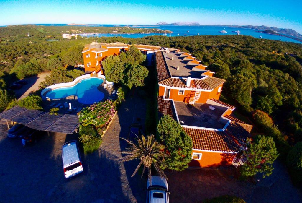 an aerial view of a house with a swimming pool at Hotel Valdiola in Porto Cervo