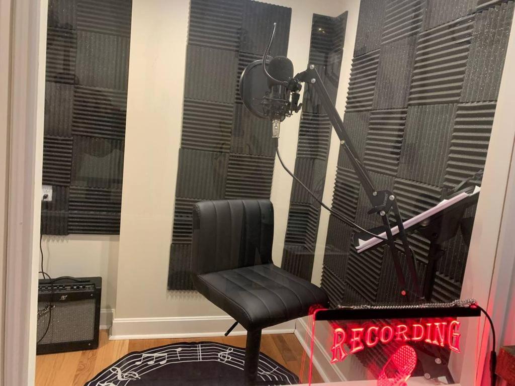 a recording room with a chair and a microphone at Temple View Inn with Music Studio in Independence