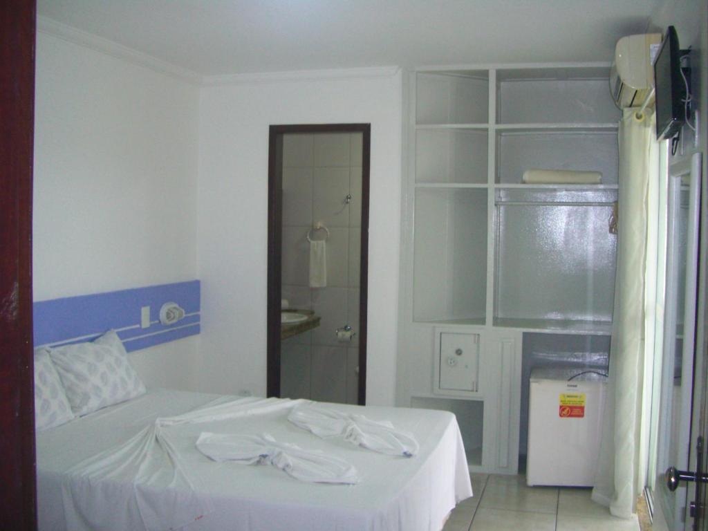 Postel nebo postele na pokoji v ubytování Hotel Ponta de Areia