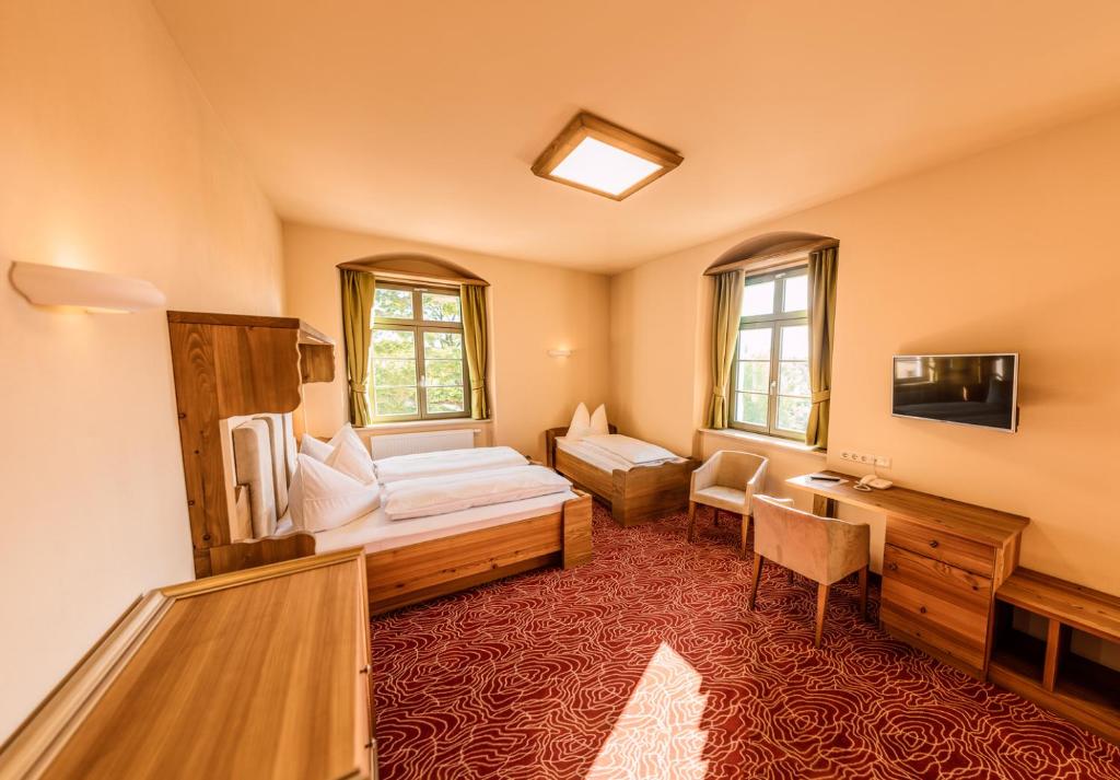 Postel nebo postele na pokoji v ubytování Hotel Freyhof