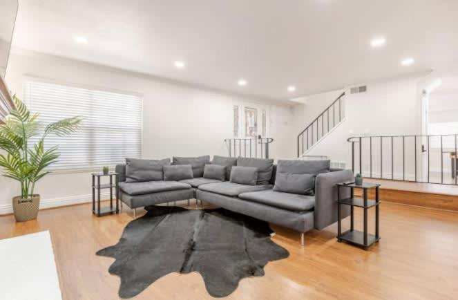 a living room with a couch and a rug at CA3 House Spacious SoCal Home for Groups in La Palma