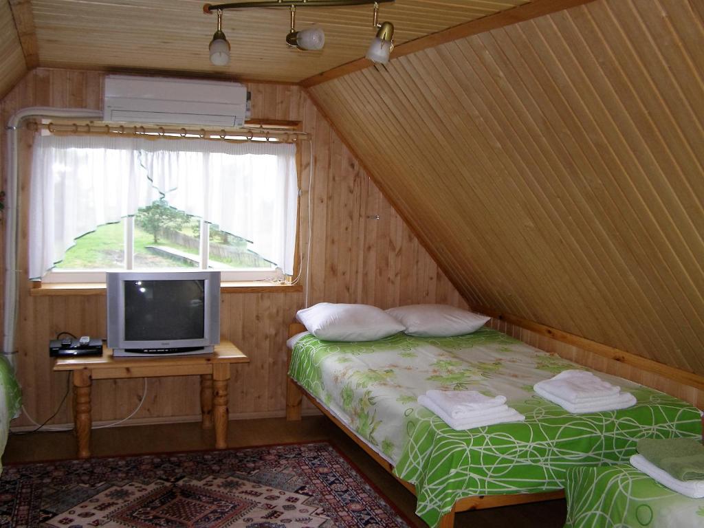 Postel nebo postele na pokoji v ubytování Treimani Puhkemaja