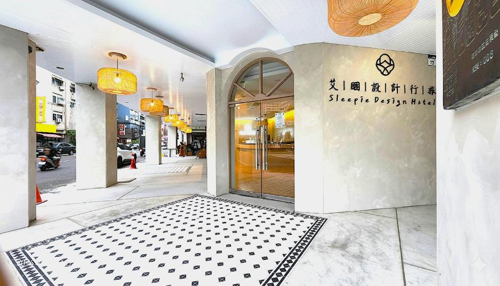 a store front with a sign on the door at 艾睏設計行旅 Sleepie Design Hotel in T'ien-liao
