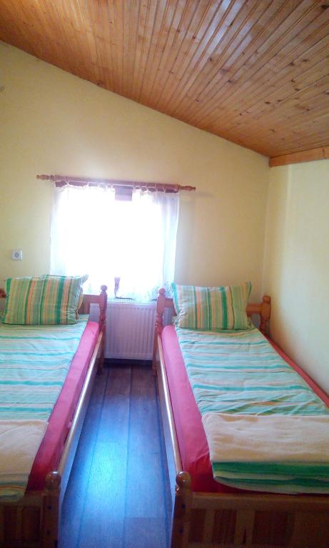 Postel nebo postele na pokoji v ubytování Guest House Lorian