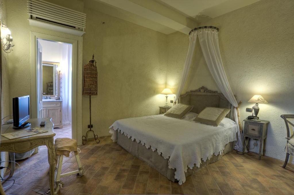 Postel nebo postele na pokoji v ubytování Il Poggio Country Resort