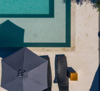a painting of an umbrella on the side of a building at The Bellevue Lodge in Lopar