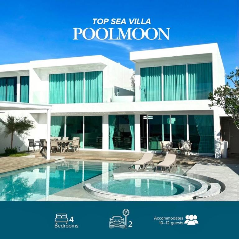 a large white building with a swimming pool at Topseavilla Poolmoon 2 bedroom in Ban Bo Yai