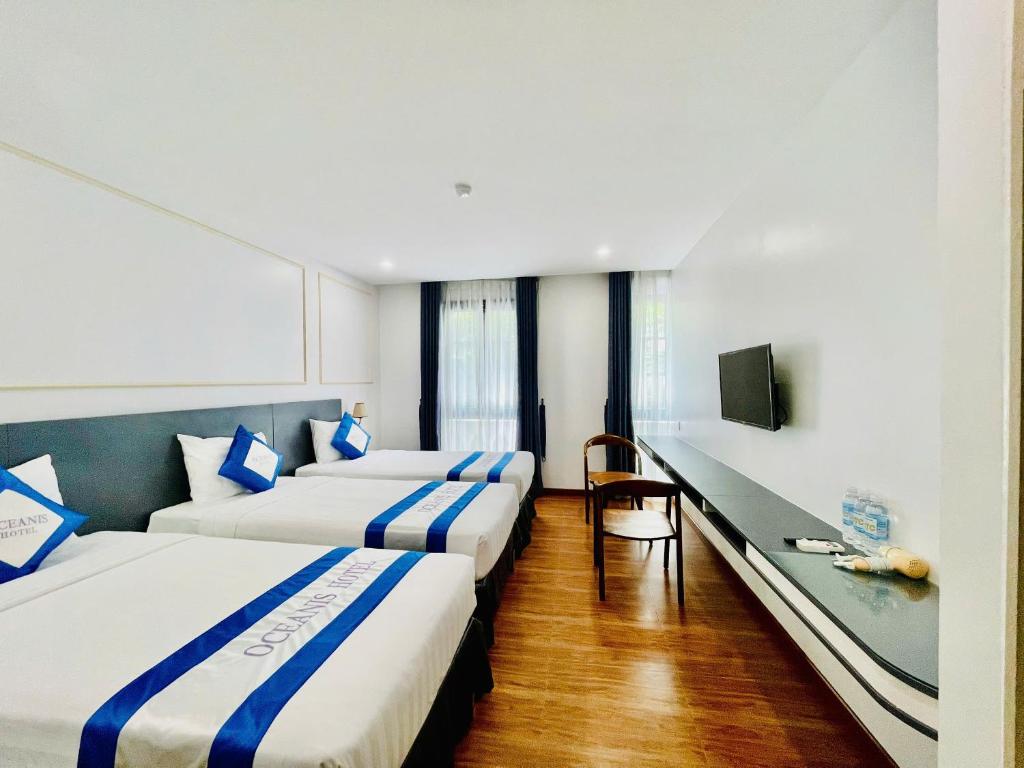 Postel nebo postele na pokoji v ubytování Oceanis Hotel