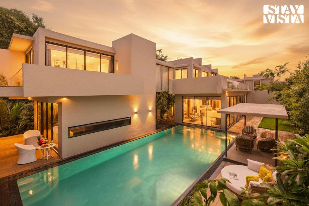 una representación de una casa con piscina en StayVista at Cielo House with Bonfire, Pool, en Alibaug