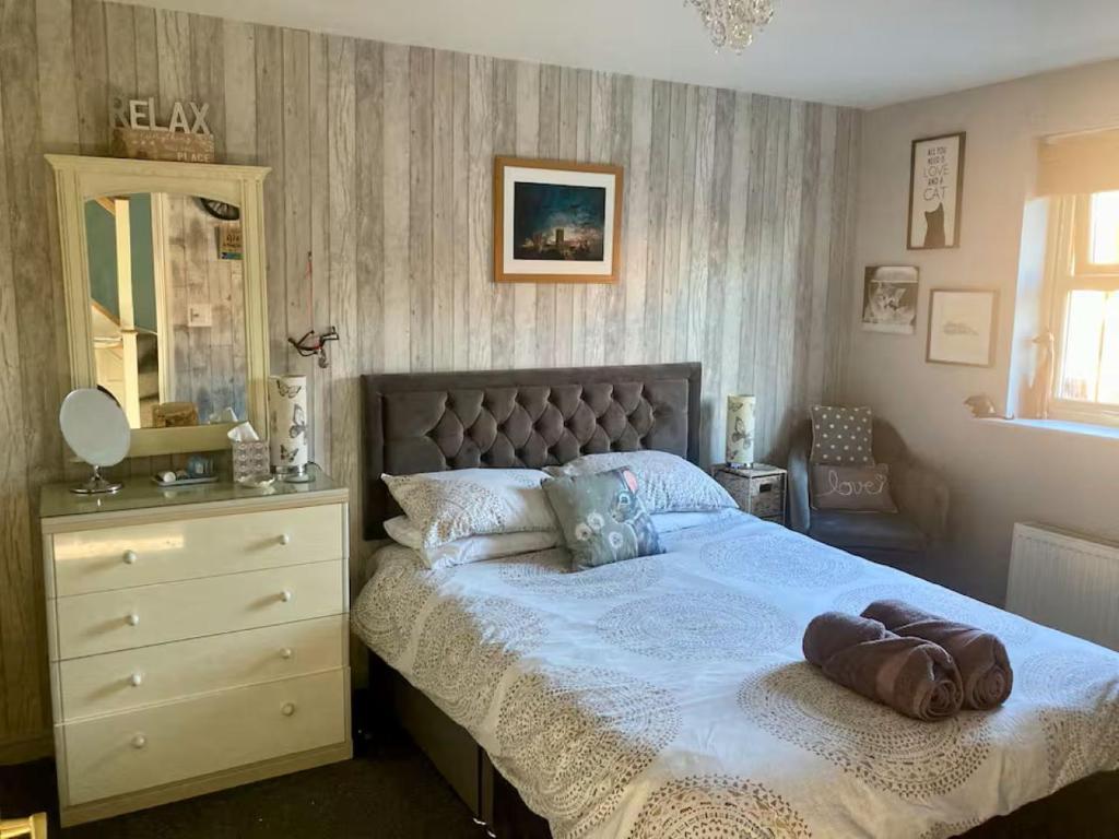 Ένα ή περισσότερα κρεβάτια σε δωμάτιο στο Sunset garden retreat