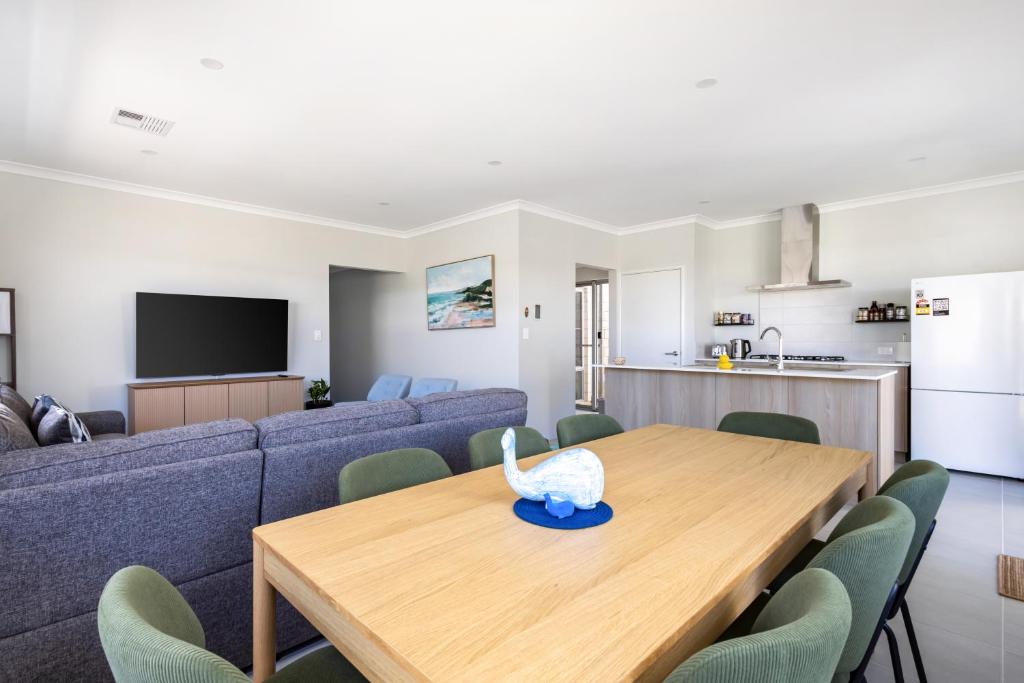 a living room with a table and a couch at Barefoot2beach By Swan Bnb Management in Yanchep