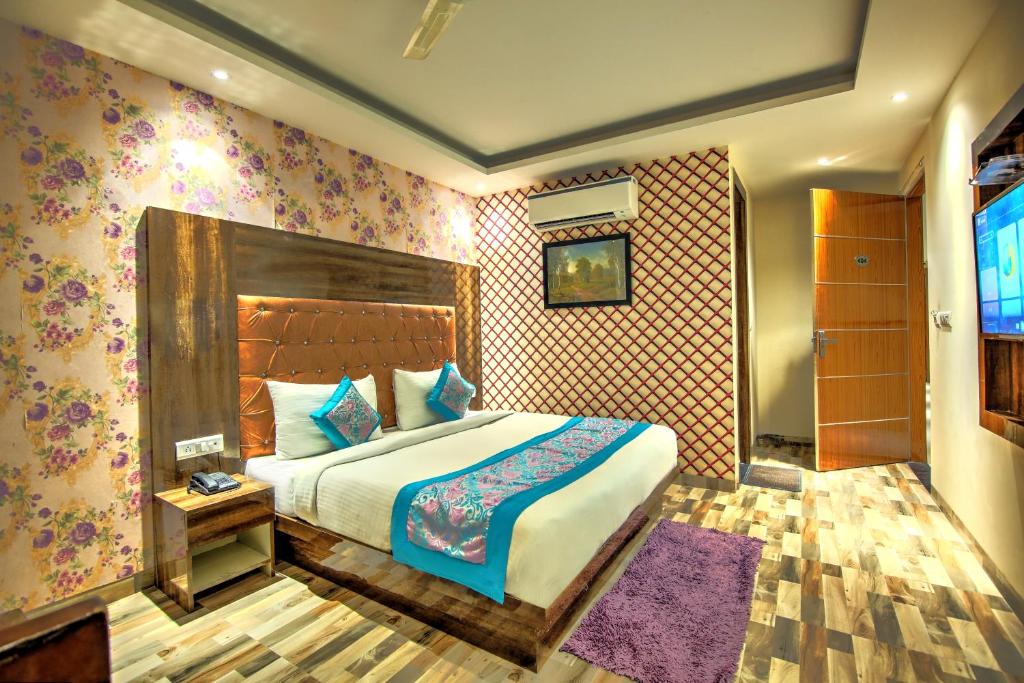 Ένα ή περισσότερα κρεβάτια σε δωμάτιο στο Smart Lax Hotel Free-Airport Pick Up