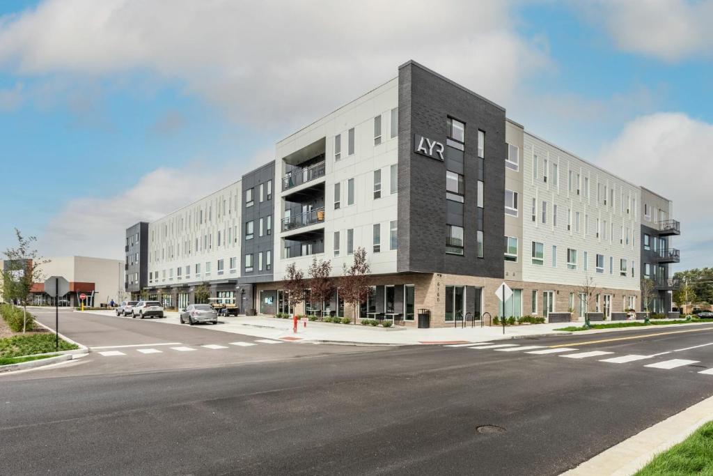 an apartment building on the corner of a street at CozySuites AYR in Indianapolis